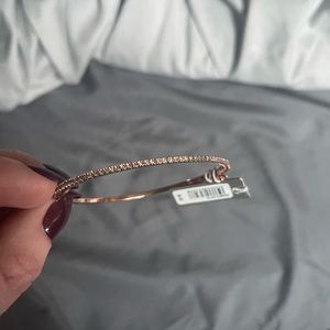 Cz and rose gold plated bangle with safety clasp